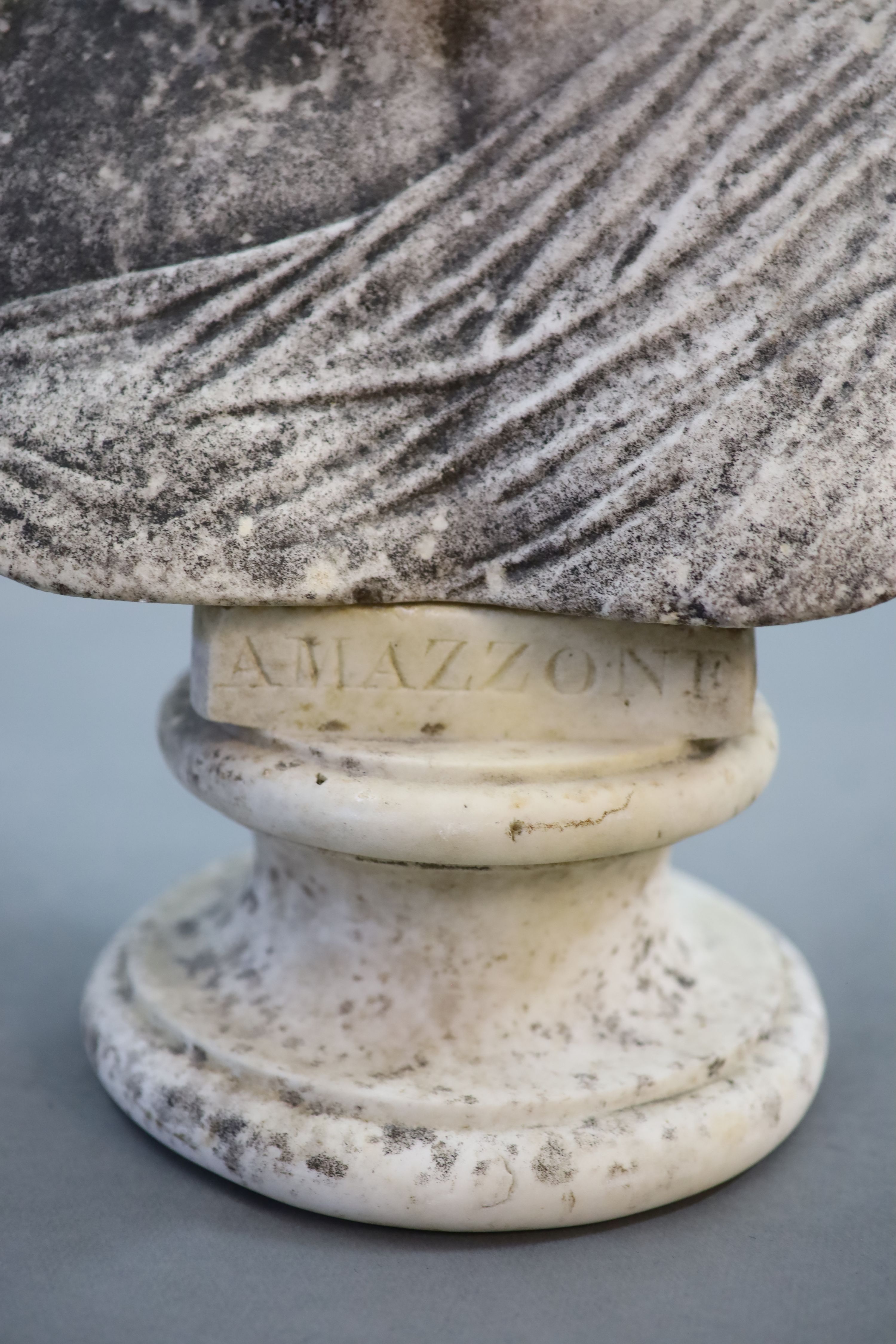 A large weathered white marble bust of a Grecian maiden, 19th centuryraised on an associated socle - Image 2 of 4