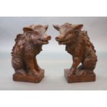 After Pietro Tacca (1577-1640), a pair of early 20th century walnut carvingsFlorentine boars (Il