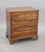 An unusually small George III mahogany chest of drawers,of four graduated long drawers, fitted