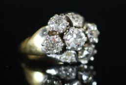 A mid 20th century 18ct gold and five stone diamond cluster ring,with diamond chip setting, total