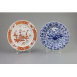 A Chinese blue and white dish and a rouge de fer plate, both Kangxi period,the dish painted with