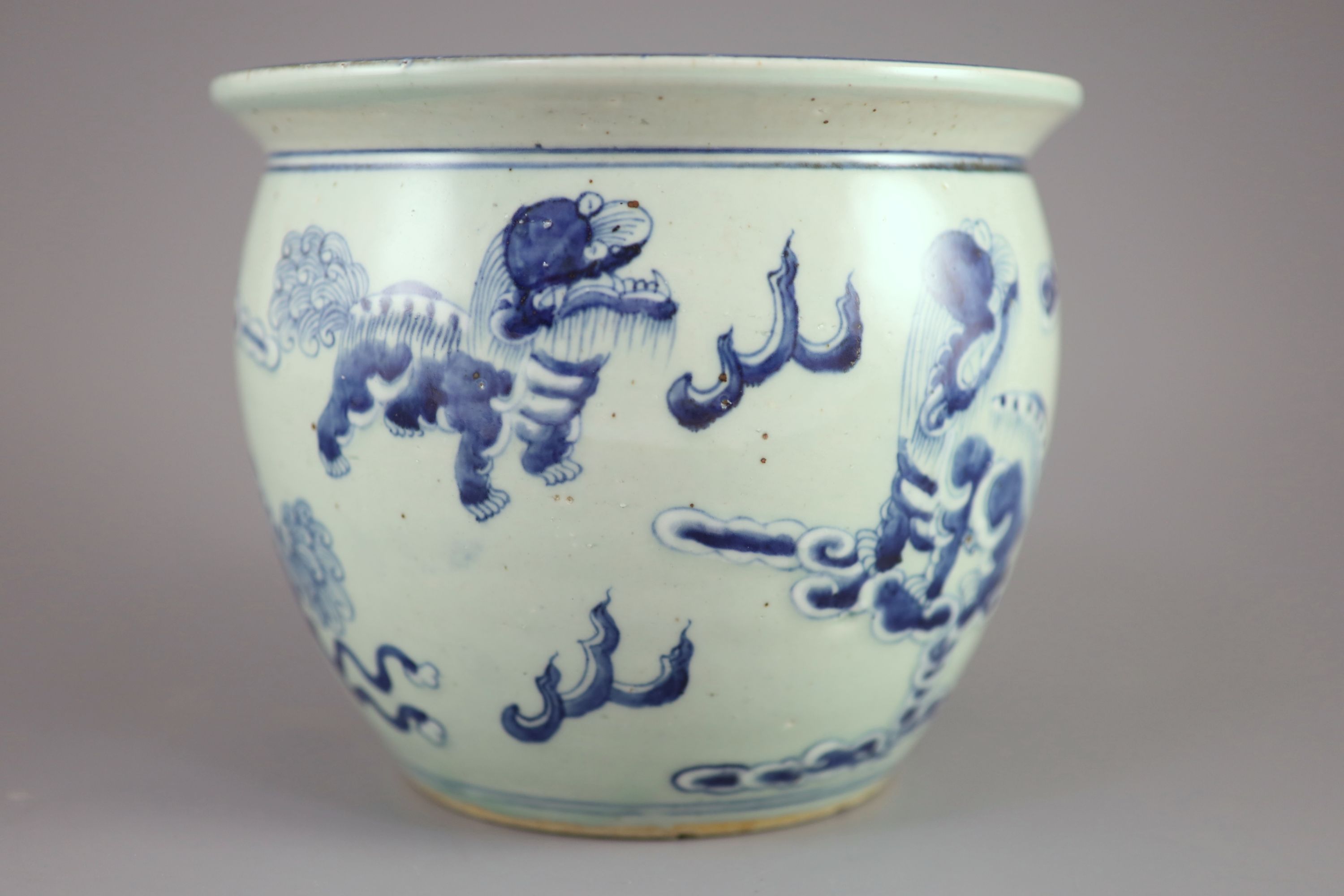 A Chinese blue and white 'lion-dog' flower pot,painted with lion-dogs on white slip, on a pale - Image 3 of 6