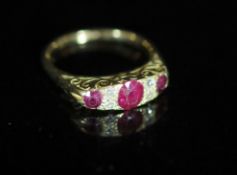 An early 20th century 18ct gold, three stone ruby and four stone diamond chip set half hoop ring,