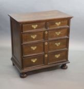 A late 17th century oak chest,of four graduated long drawers, on pad feet,W.93cm D.55cm H.95cm