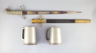 An Edward VII Naval officer’s dress dirkwith EVIIR cipher, and brass-mounted leather scabbard,