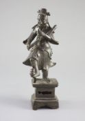 A Chinese bronze figure of an immortal, late Ming dynasty,holding objects in each hand his right