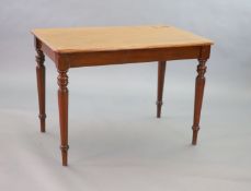 A Victorian mahogany writing table,with rounded rectangular top inset with a brass lidded inkwell,