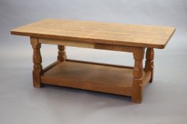 A Thompson of Kilburn Mouseman oak 'refectory' coffee table,with rounded rectangular top on tapered