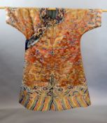 A Chinese apricot embroidered silk ‘dragon’ formal court robe, jifu, late Qing Dynasty,worked in