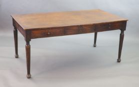 A late Victorian mahogany library table,fitted four short and one deep drawer to one side of the