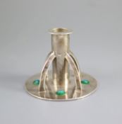An Edwardian Arts & Crafts silver and enamelled dwarf candlestick by William Hutton & Sons,with