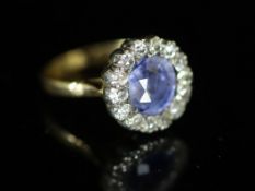 A 19th century? gold, sapphire and diamond set circular cluster ring,the central Ceylon? sapphire