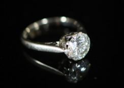 A modern 18ct white gold and solitaire diamond ring,the stone weighing approximately 2.10ct, size