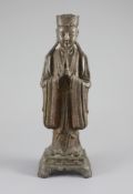 A Chinese bronze standing figure of an immortal, late Ming, 17th century,with remnants of original