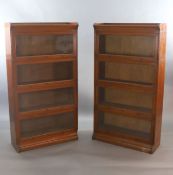 A pair of Globe Wernicke style oak sectional bookcases,with three quarter galleries and four glazed