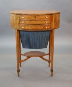 A George III rosewood banded satinwood oval work table,with rising top enclosing a fitted interior