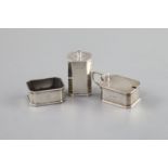 Royal Interest - a three piece silver cruet set,comprising mustard pot, salt and pepper pot,