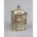 An Edwardian Art Nouveau silver tea caddy by Connell,of square form, with planished cover and ball