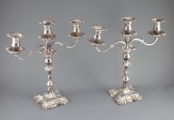 A modern pair of silver two branch, three light candelabra by Roberts & Belk,with waisted knopped
