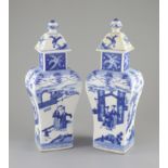 A pair of Chinese blue and white rectangular baluster vases and covers, Kangxi marks but 19th