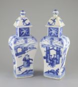 A pair of Chinese blue and white rectangular baluster vases and covers, Kangxi marks but 19th