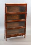 A Globe Wernicke mahogany four section bookcase,with sliding glass doors and squared legs,W.86.5cm