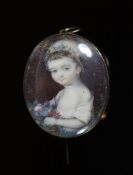 A Georgian miniature oval watercolour portrait of a child with flowers, in gold pendant brooch