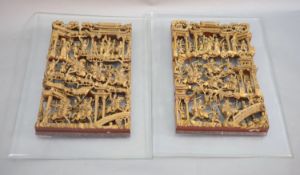 A pair of Chinese giltwood panels, late 19th centuryeach carved with battle scenes with dignitaries