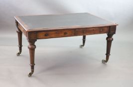 A Victorian mahogany library table,the rectangular top inset with an old black leather skiver,