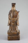 A Chinese boxwood figure of an immortal, 19th century,the figure holding a tablet in his left hand