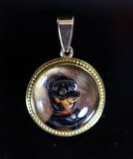 A Victorian gold mounted Essex crystal circular pendant, decorated with a terrier dog,21mm, gross