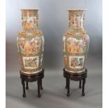 * A pair of massive Chinese Canton style famille rose vases, 20th century and a pair of Chinese