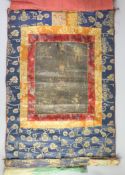 A Tibetan Buddhist thangka, 17th /18th century,depicting Padmasambhava seated on a lotus throne,