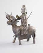 A Chinese white metal model of a boy riding a qilin , early 20th century,well modelled with