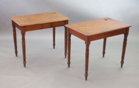 A pair of Victorian mahogany writing tables,with rounded rectangular tops, once fitted with