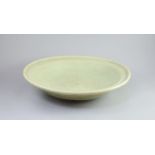 A Chinese Ming Longquan celadon dish, 15th/16th century,crackle to the glaze all over,43cm diameter
