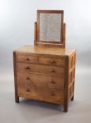 A Robert Thompson Mouseman oak dressing chest,the raised back with a rectangular mirror supported