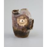 An unusual Martin Bros stoneware grotesque bulb pot, dated 1907,modelled as a head with holes at