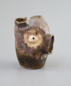 An unusual Martin Bros stoneware grotesque bulb pot, dated 1907,modelled as a head with holes at
