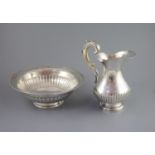 A mid 19th century Portuguese silver jug and bowl set,with engraved and demi fluted decoration,