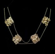 An early 20th century Chinese filigree gold (stamped 20) twin strand necklace with six pierced