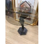 An Art Deco style occasional table with a figural metal female base, base height 60cm glass top