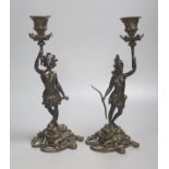 A pair of 19th century French bronze candlesticks, modelled as natives, height 32cm