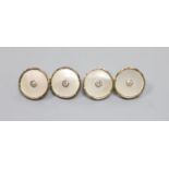 A pair of 18ct, mother of pearl and diamond set circular cufflinks,13mm, gross weight 5.8 grams.