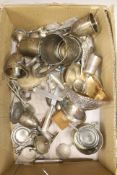 A quantity of plated tableware and cutlery