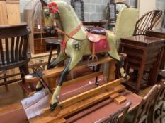 A 1920's F.H. Ayres painted wood rocking horse, on a trestle stand, fully restored in 2009 by