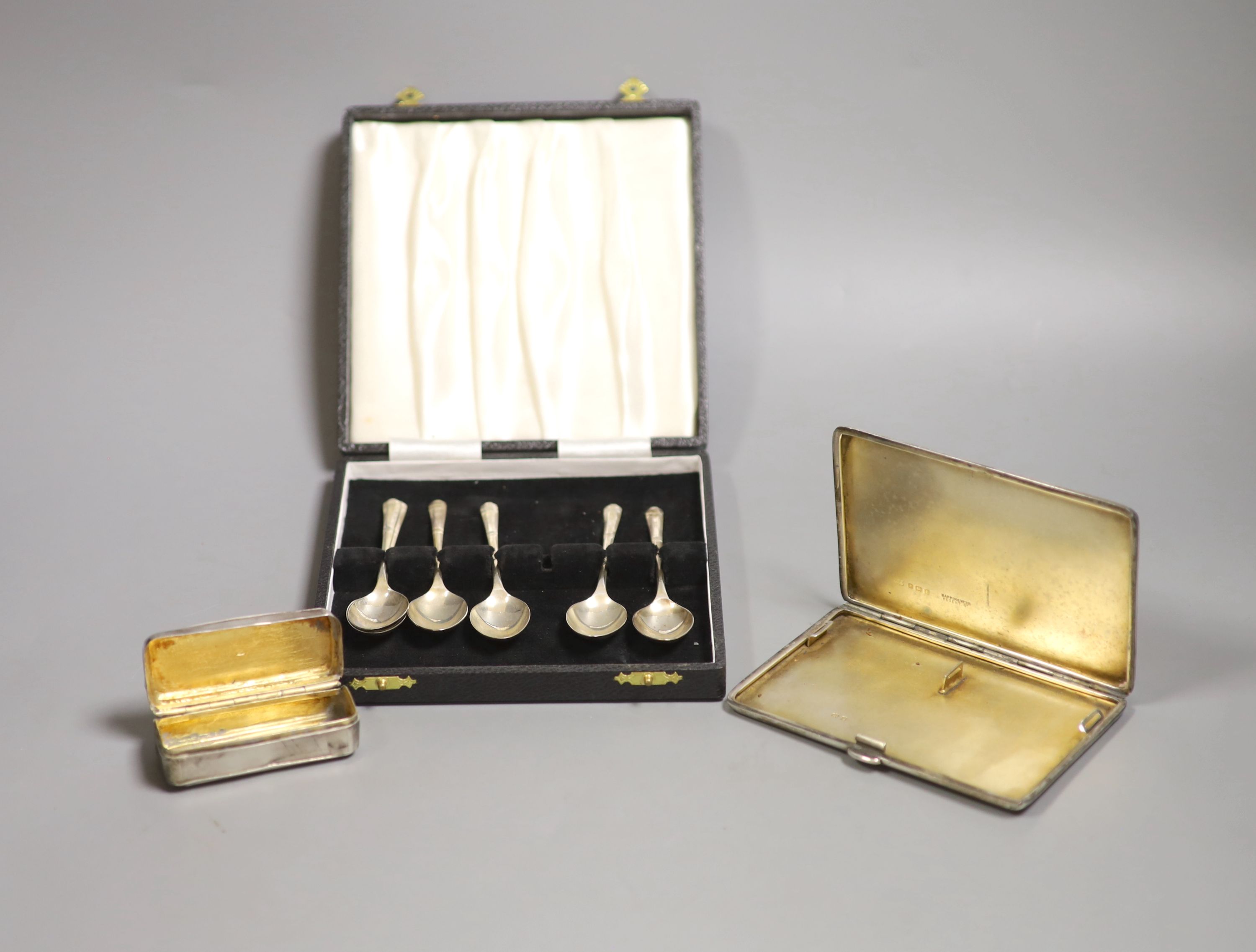 A George V silver cigarette case, 12.7 cm, a 900 standard white metal snuff box and five silver