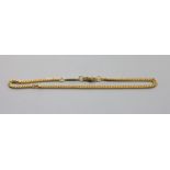 A continental 585 yellow metal curb link bracelet,22cm, 6.2 grams.