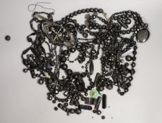 A quantity of assorted mainly jet jewellery including cross pendant necklaces and locket pendant