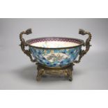 A 19th century French ormolu mounted faience bowl on ornate dragon design stand, 23cm high